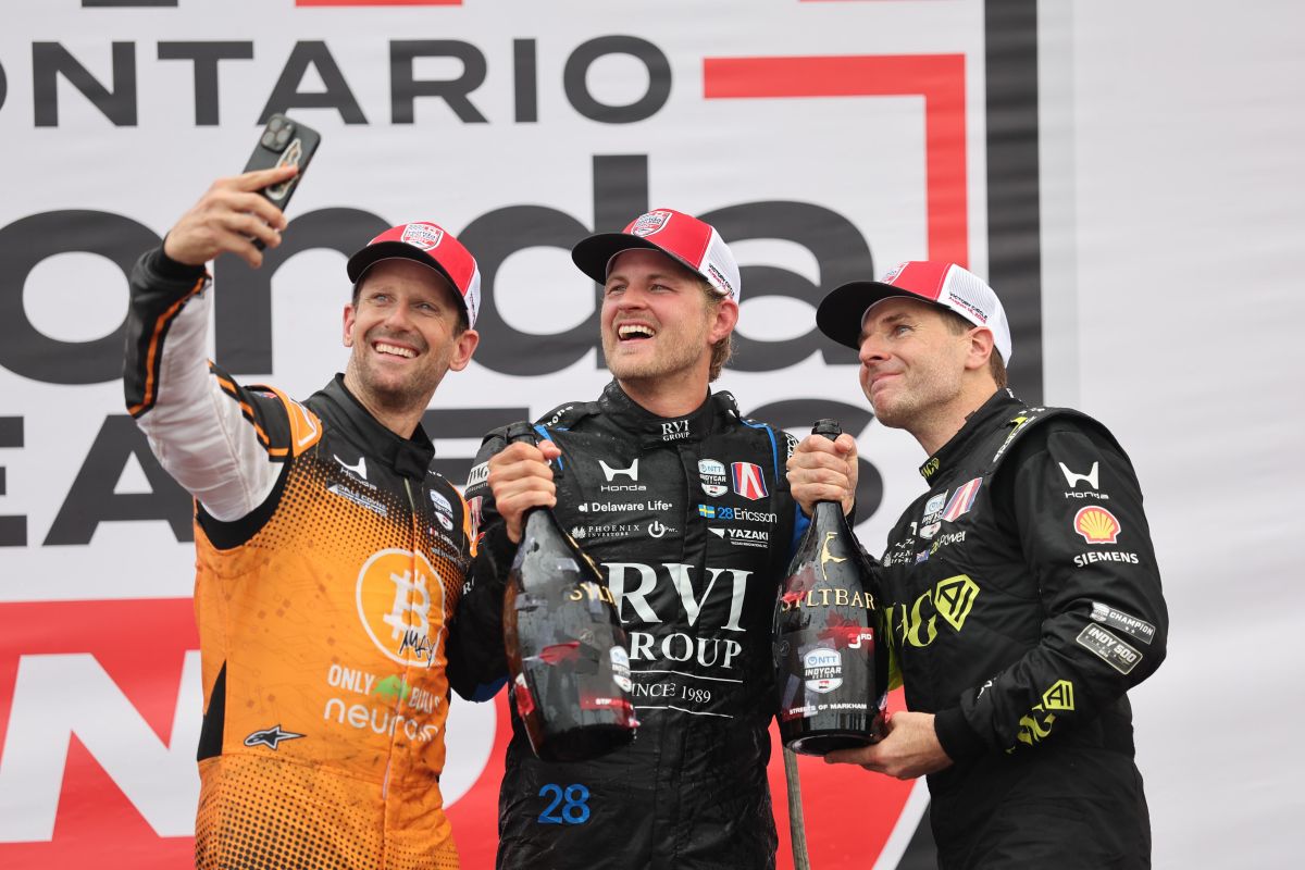 Romain Grosjean, Marcus Ericsson en Will Power op het podium van Markham