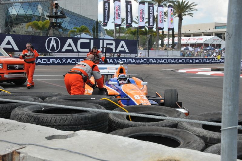Charlie  Kimball assisted by safety team, St. Petersburg
