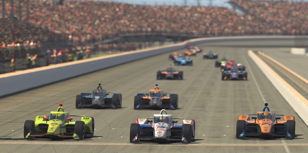 Simon Pagenaud, Graham Rahal en Lando Norris naast elkaar op het rechte stuk